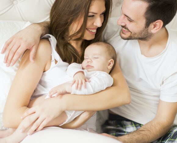 Happy family with newborn baby