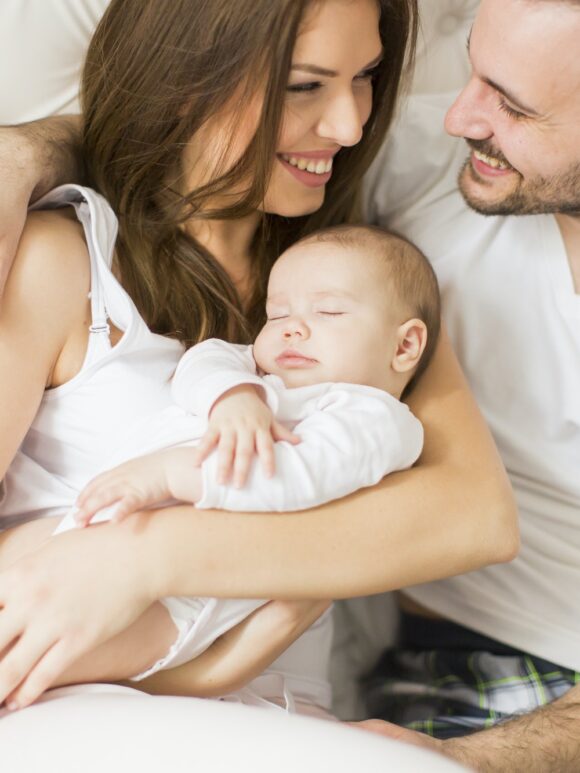 Happy family with newborn baby